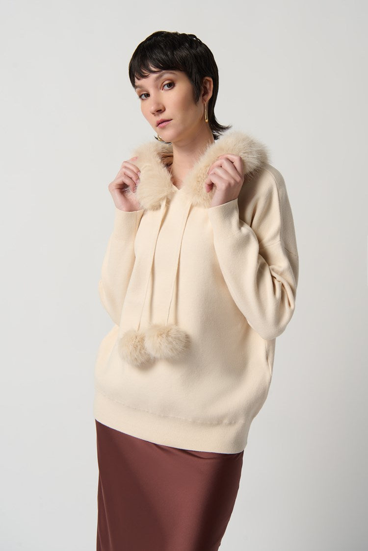 SWEATER WITH FAUX FUR HOOD AND POMPOMS